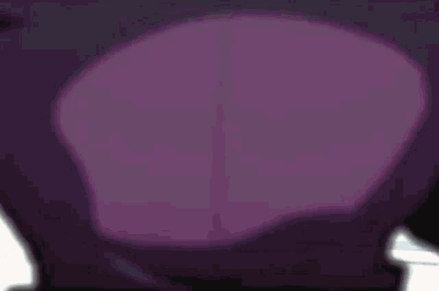 a close up of a purple cartoon character 's chest and stomach .