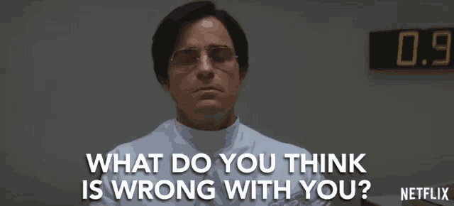 a man in a lab coat and glasses is asking what do you think is wrong with you