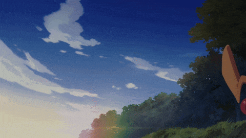 a blue sky with trees in the foreground