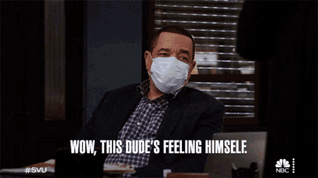 a man wearing a face mask with the words wow this dude 's feeling himself written below him