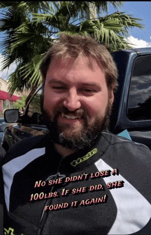 a man with a beard is wearing a jacket that says alpinestars on it