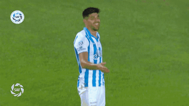 a soccer player wearing a blue and white striped shirt that says jeep on it