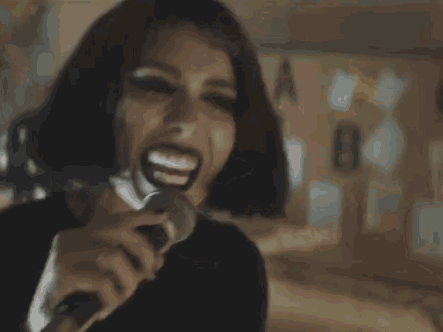 a woman is screaming into a telephone while saying i love you