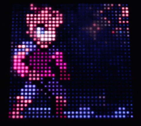 a pixel art of a person holding a ring in a dark room