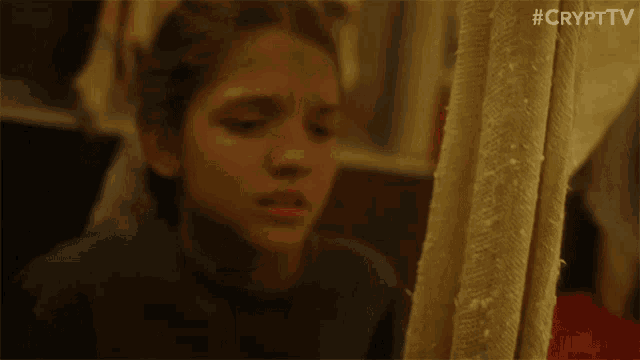 a girl is sitting in front of a shower curtain with #crypttv on the bottom