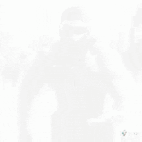 a shirtless man wearing a black mask and sunglasses is a tik tok video