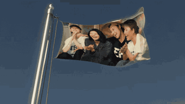 a flag with a picture of a group of people with the letters ff on it