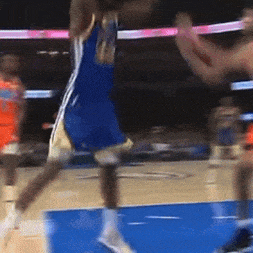 a basketball player in a blue jersey with the number 21 on it is jumping in the air