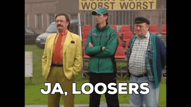 a group of men are standing in front of a sign that says worst worst
