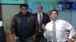 a group of men are standing next to each other in a room .