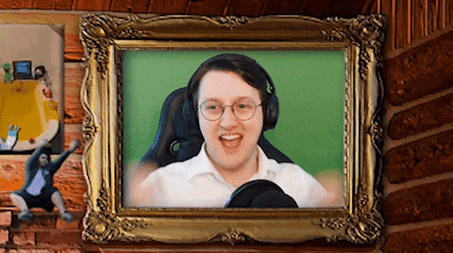 a picture of a man wearing headphones and glasses in a gold frame