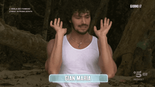 a man in a white tank top with the name gian maria