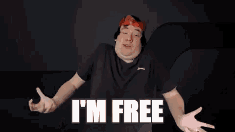 a man with his arms outstretched and the words i 'm free on his chest