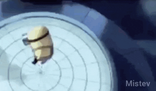 a minion is spinning in a circle in a video game and looking at the camera .
