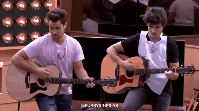 two men playing guitars with the hashtag furbysinpilas