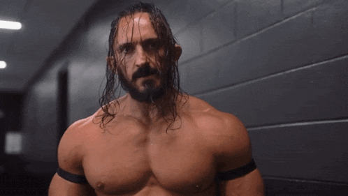 a man with long hair and a beard without a shirt