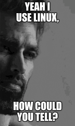 a black and white photo of a man with a beard and the caption yeah i use linux how could you tell