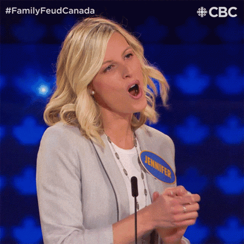 a woman with a name tag that says jennifer is speaking into a microphone