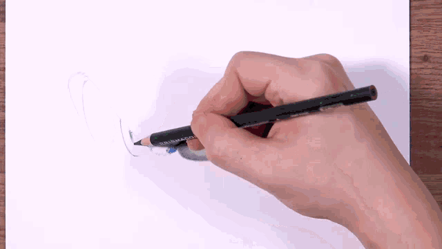 a person is drawing with a pencil that says prismacolor