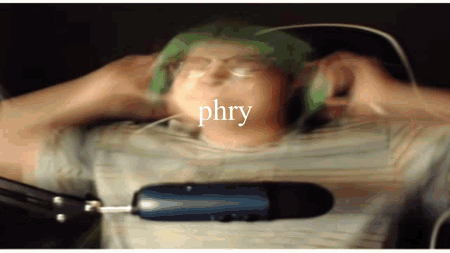 a blurry image of a person with the word phry written on their face