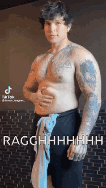 a shirtless man with tattoos on his arms and chest is holding his belly .