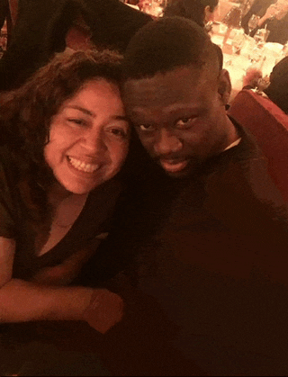 a man and woman are posing for a picture together