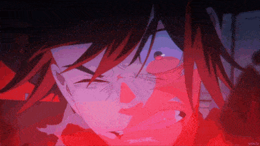a close up of a person 's face with a red background that says nmk.tv