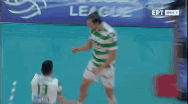 a man in a green and white jersey with the word van on the back