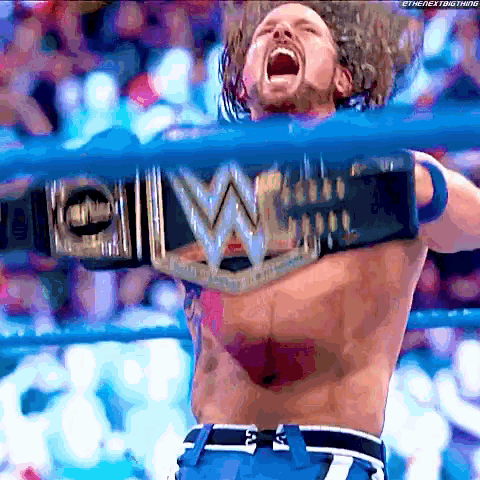 a shirtless wrestler holding a wwe championship belt