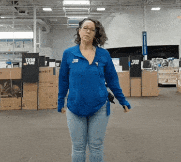 a woman in a blue shirt with the word team on it