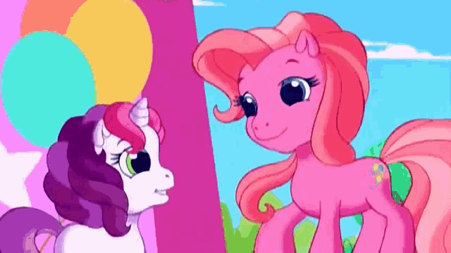two pink ponies are standing next to each other and smiling