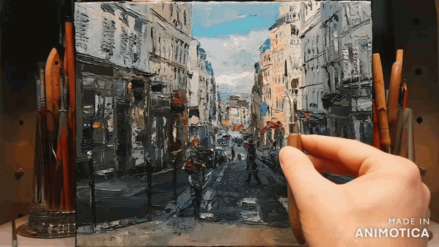 a hand is holding a small painting of a city street made in animotica
