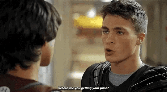 two young men are talking to each other and one of them is asking where are you getting your juice .