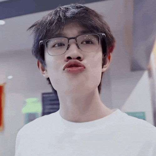 a young man with glasses and a fake mustache