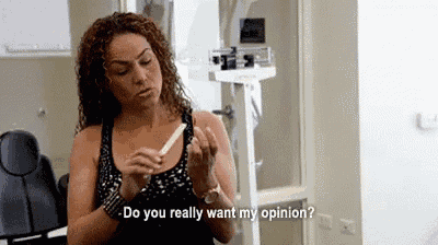a woman is holding a stick in her hand and saying `` do you really want my opinion '' .