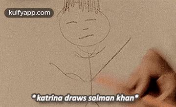 a woman is drawing a picture on a whiteboard .