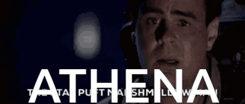 a close up of a man 's face with the word athena in white letters