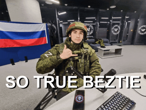 a man in a military uniform giving a thumbs up in front of a russian flag and the words so true beztie