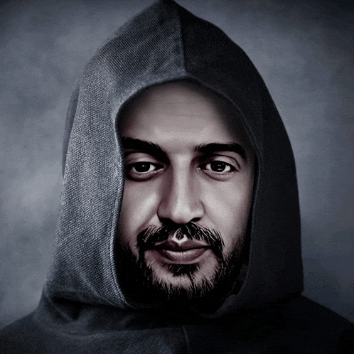 a man with a beard wearing a hooded jacket