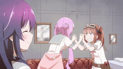 a girl with purple hair is giving a high five to another girl