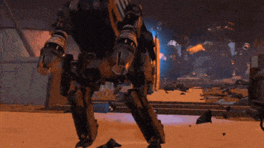 a robot is standing on its hind legs in a destroyed building .