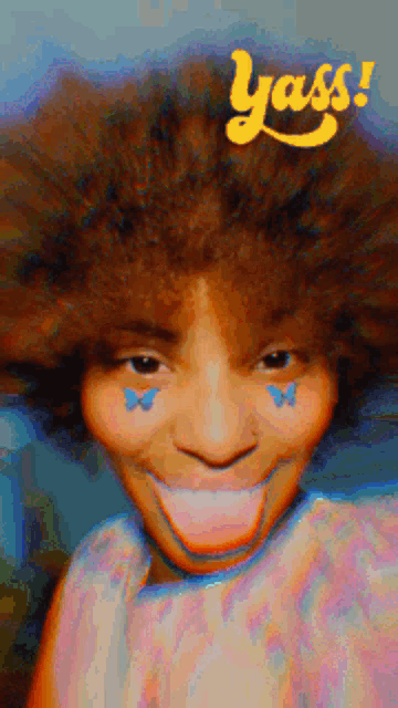 a woman with butterfly stickers on her face and the word yass on the top