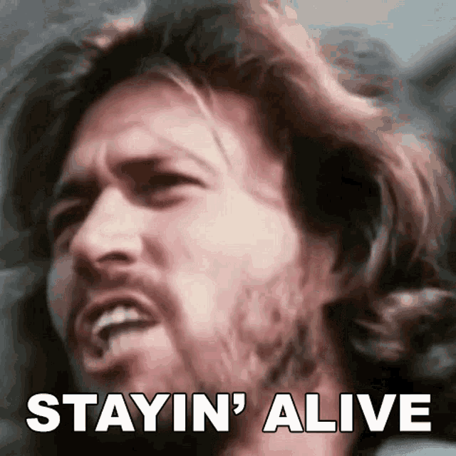 Stayin Alive Barry Gibb GIF - Stayin Alive Barry Gibb Bee Gees GIFs