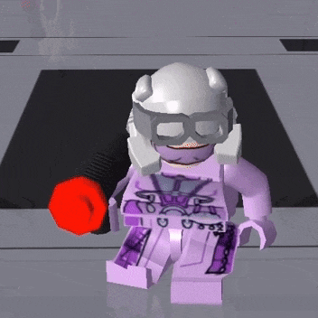a lego figure with a purple outfit and a white helmet is holding a red object