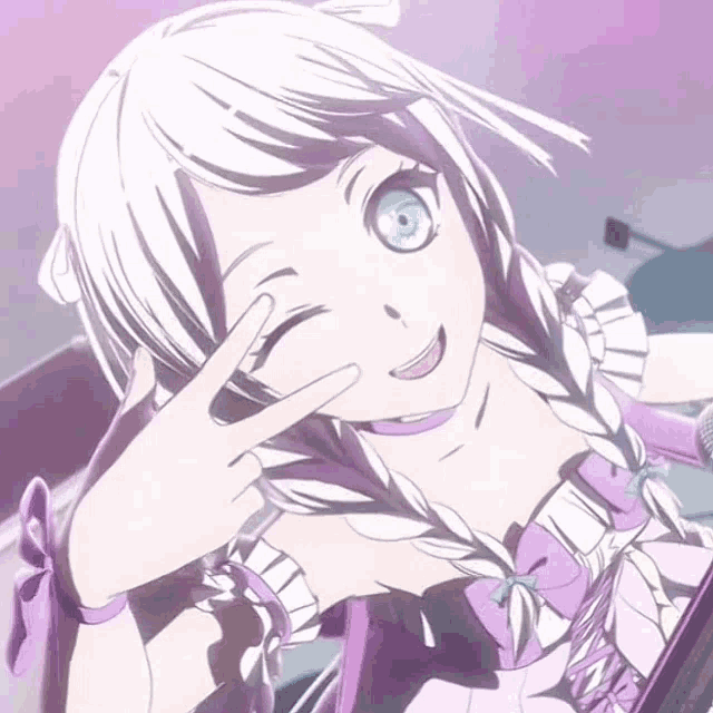 a girl in a purple dress is giving a peace sign