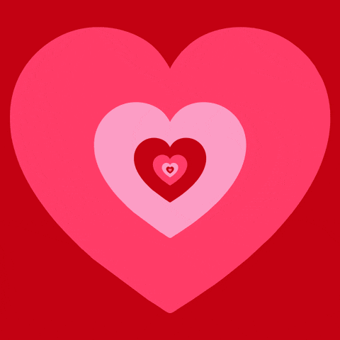 a pink heart with red hearts in it