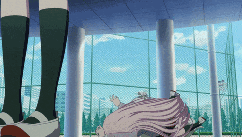a girl with pink hair is laying on the ground in front of a fence