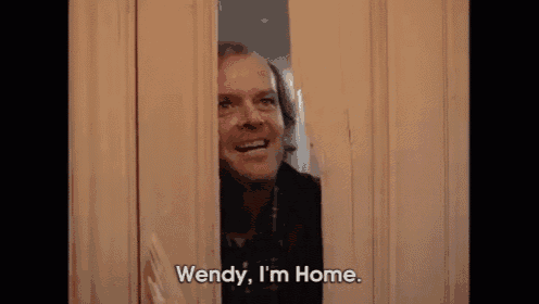 a man is peeking through a door and saying `` wendy , i 'm home '' .