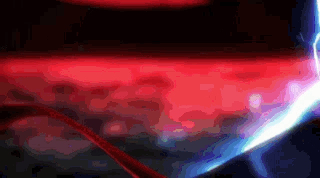 a red lightning bolt is coming from a dark background