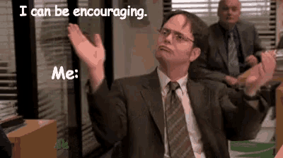 a man in a suit and tie is sitting in an office with his arms in the air and says i can be encouraging